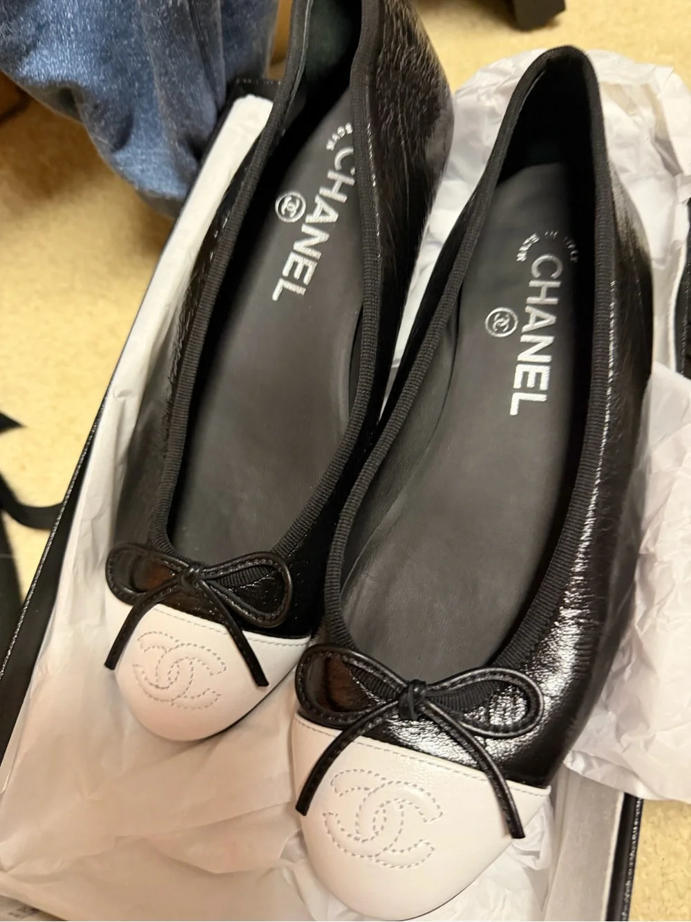 CHANEL Black and White Leather Cap-Toe Ballet Flats with Bow